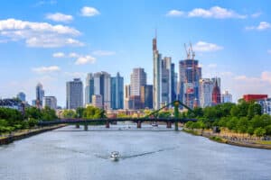 Frankfurt Skyline at dusk, showcasing a mix of historic and modern high-rise buildings.